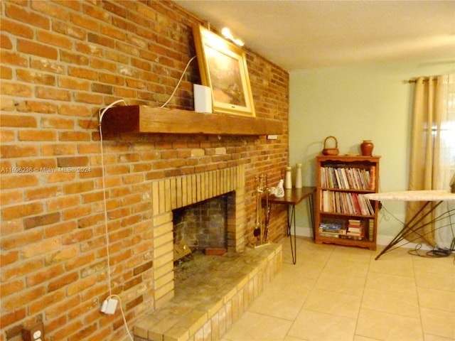 interior space with a fireplace, light tile patterned floors, and brick wall