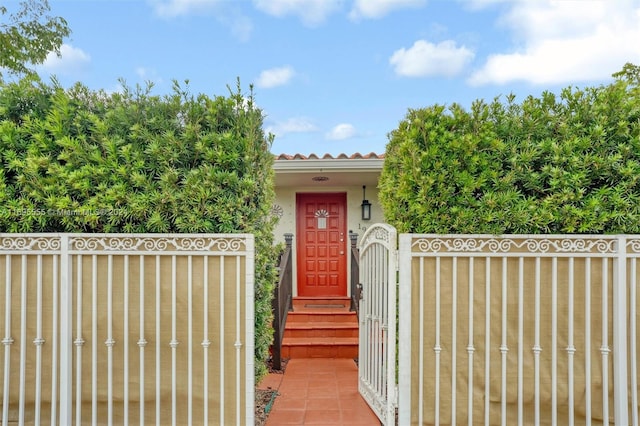 1900 SW 21st Ave, Miami, FL 33145 - entrance to property featuring a gate, stucco siding, and a tile roof