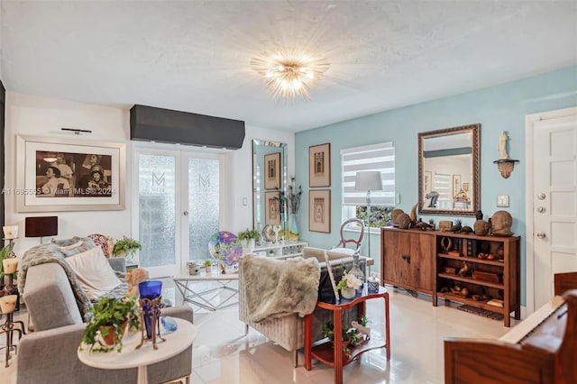 living room featuring french doors, light tile patterned floors, and an inviting chandelier