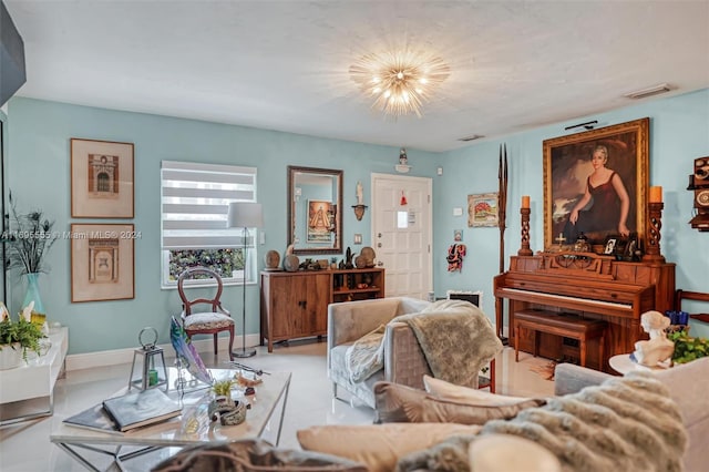 tiled living room featuring a notable chandelier