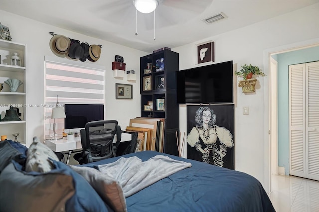 bedroom with tile patterned floors and ceiling fan