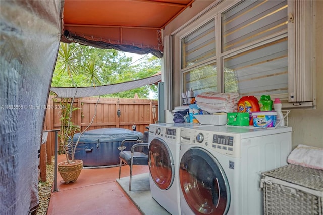 laundry area with independent washer and dryer