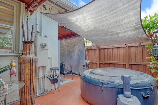 view of patio featuring a hot tub