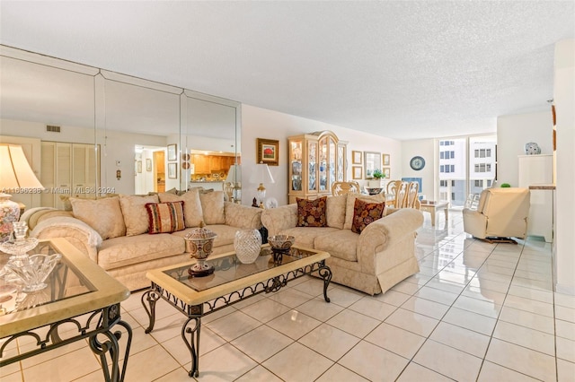 tiled living room with a textured ceiling