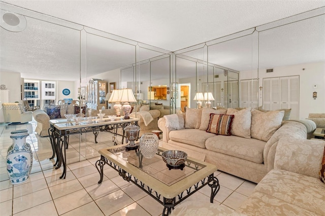 tiled living room featuring a textured ceiling