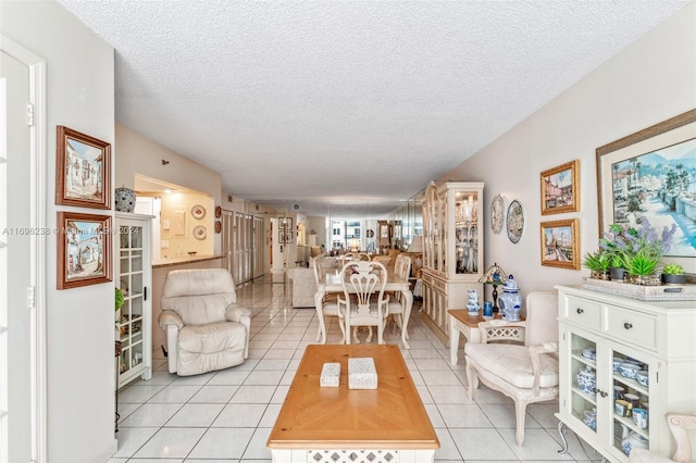 tiled living room with a textured ceiling