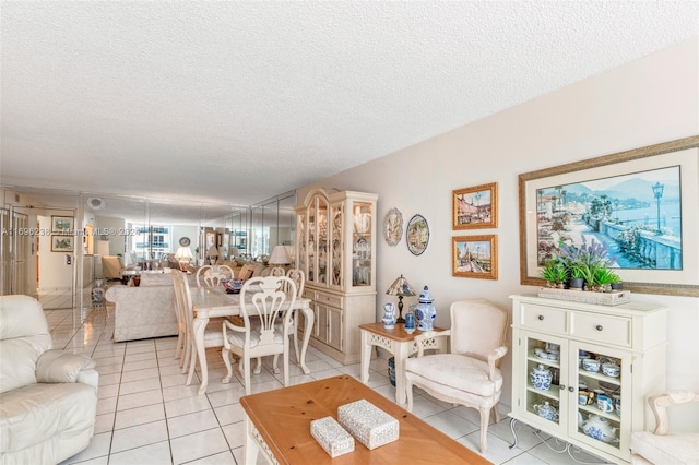 living room with light tile patterned floors and a textured ceiling