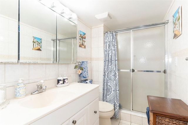 bathroom featuring walk in shower, tile patterned flooring, tile walls, and toilet