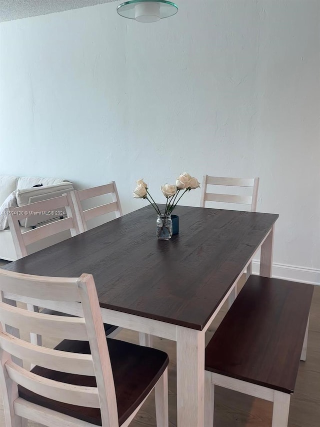 dining room with a textured ceiling