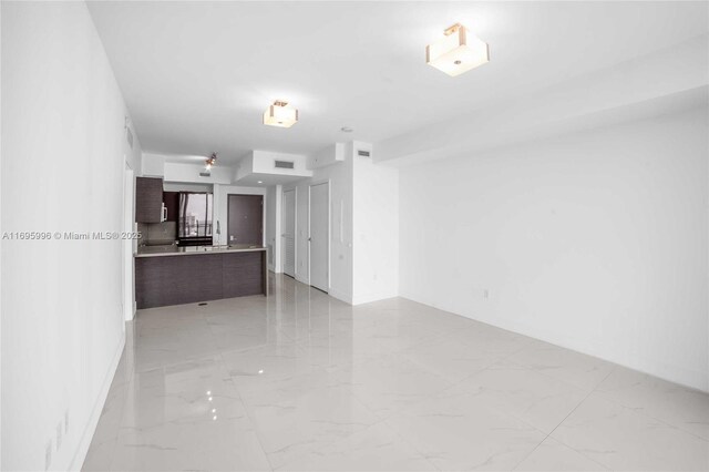 1080 Brickell Ave Unit 3604, Miami, FL 33131 - empty room featuring light marble finish floors and baseboards