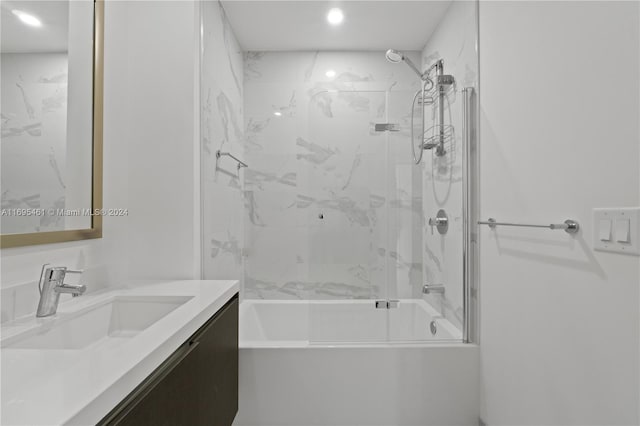 bathroom featuring vanity and tiled shower / bath combo