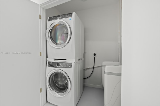 laundry area featuring stacked washer and dryer