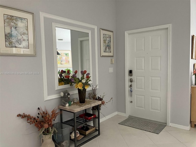 entrance foyer featuring light tile patterned floors