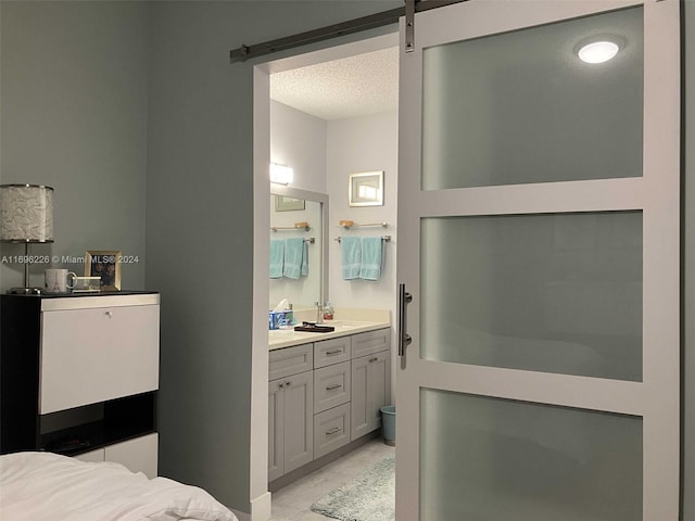 bathroom featuring vanity and a textured ceiling