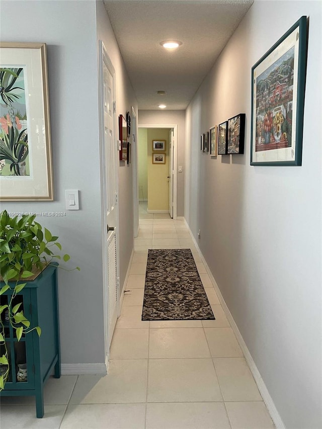 hall with light tile patterned flooring