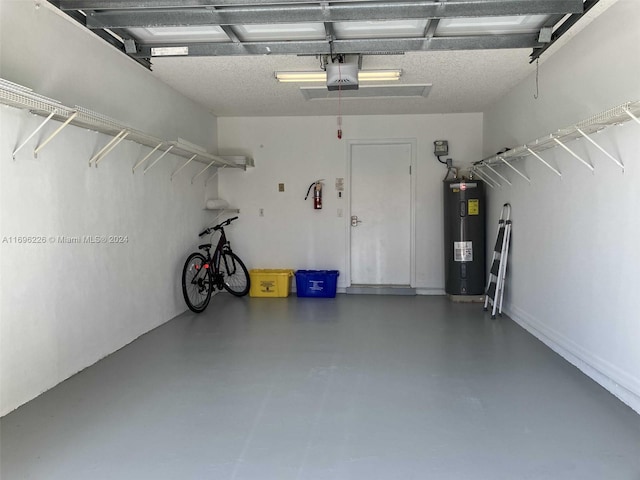 garage featuring electric water heater and a garage door opener