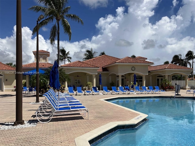 view of swimming pool with a patio area