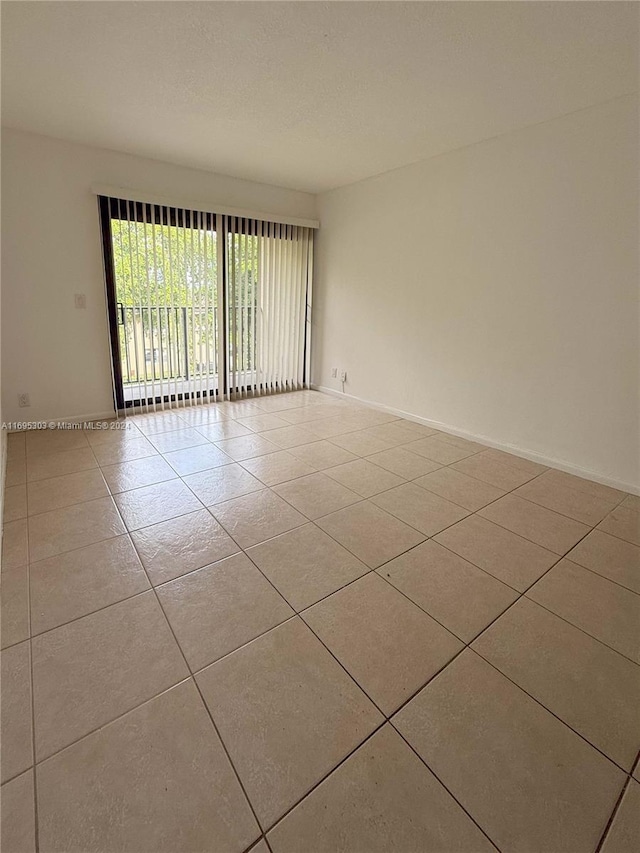 view of tiled spare room