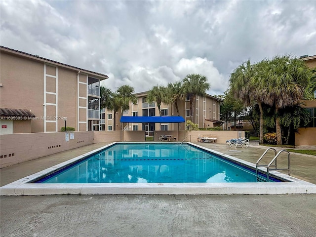 view of swimming pool with a patio area