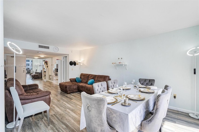 dining area with wood-type flooring