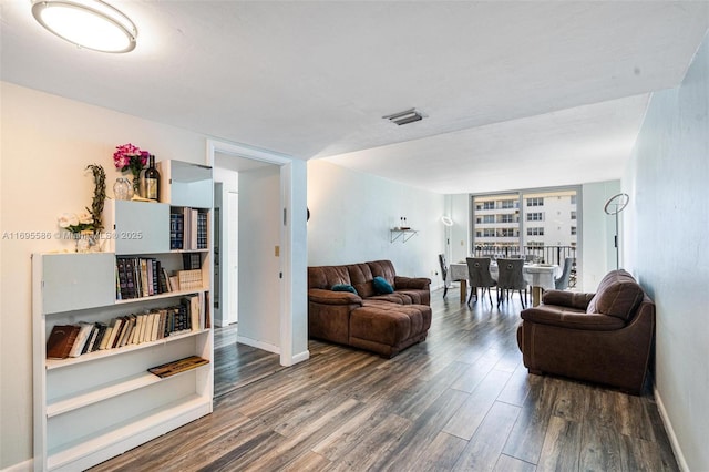 living room featuring dark wood-type flooring