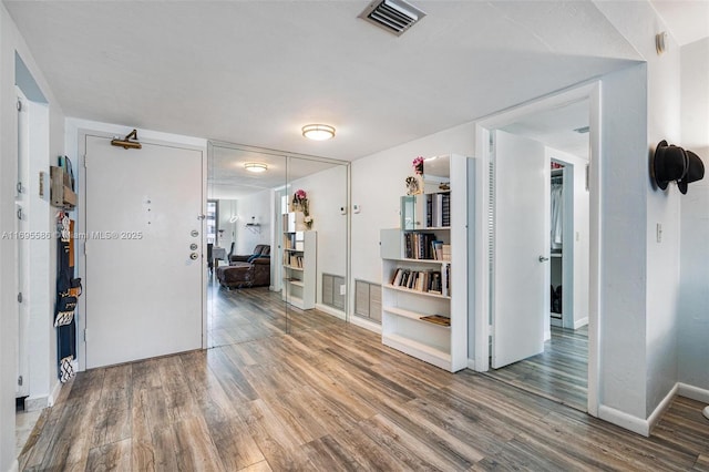 hallway featuring wood-type flooring