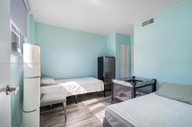 bedroom with a closet and light wood-type flooring