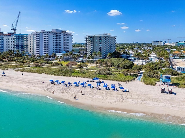 bird's eye view with a view of the beach and a water view