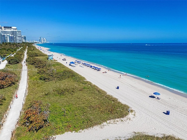 aerial view featuring a beach view and a water view