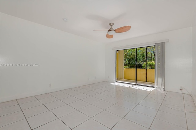 unfurnished room featuring light tile patterned floors and ceiling fan