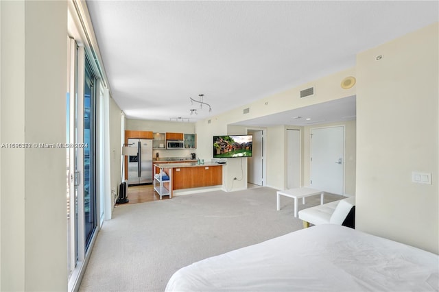 bedroom with light carpet and stainless steel refrigerator with ice dispenser