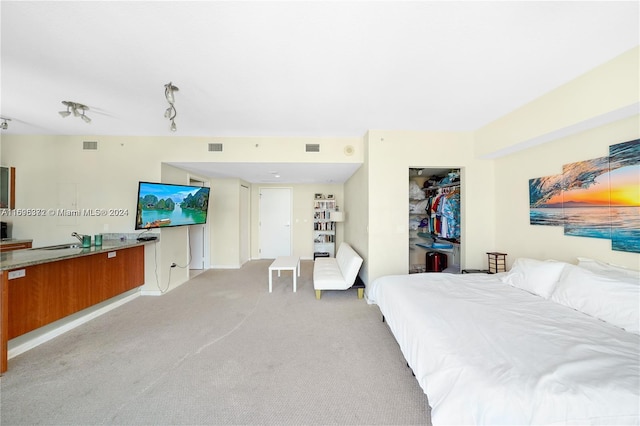 bedroom with light colored carpet