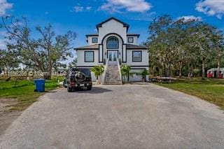 view of front of home featuring a garage and a front lawn