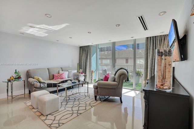 living room with floor to ceiling windows