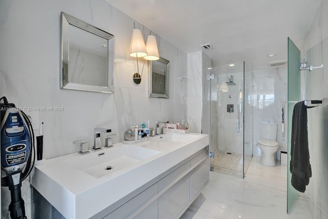 bathroom featuring vanity, toilet, walk in shower, and tile walls