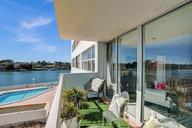 balcony featuring a water view