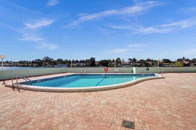 view of pool featuring a patio area