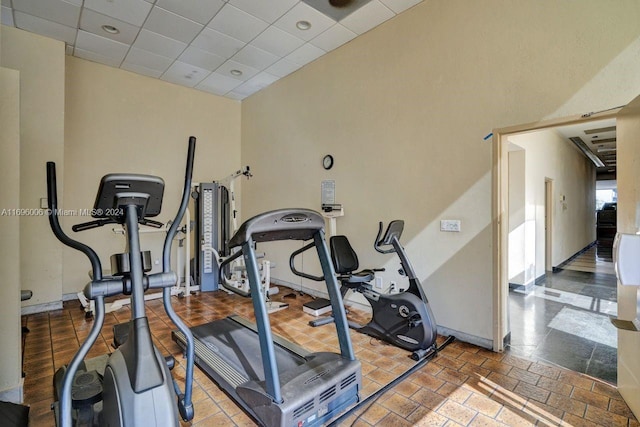 exercise room with a paneled ceiling