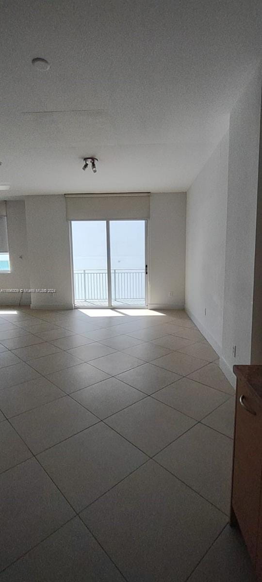 empty room featuring a textured ceiling