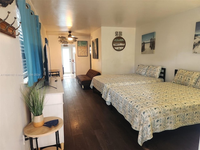 bedroom with ceiling fan and dark wood-type flooring