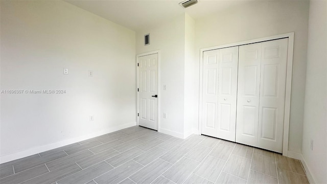 unfurnished bedroom featuring a closet