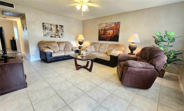 tiled living room with ceiling fan