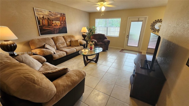 tiled living room featuring ceiling fan