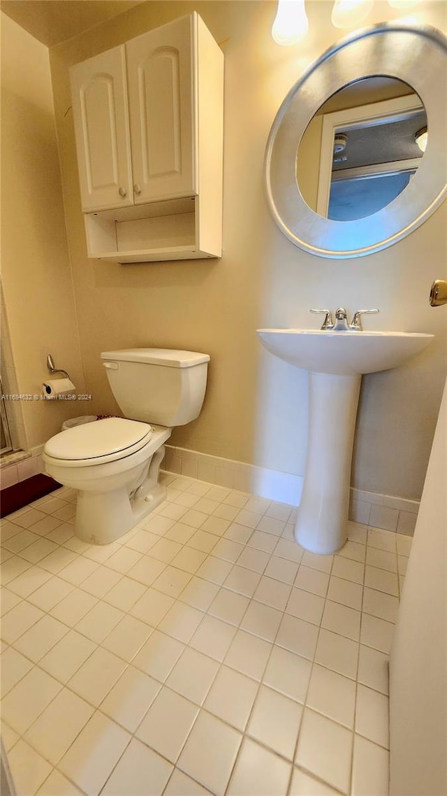 bathroom with tile patterned flooring and toilet