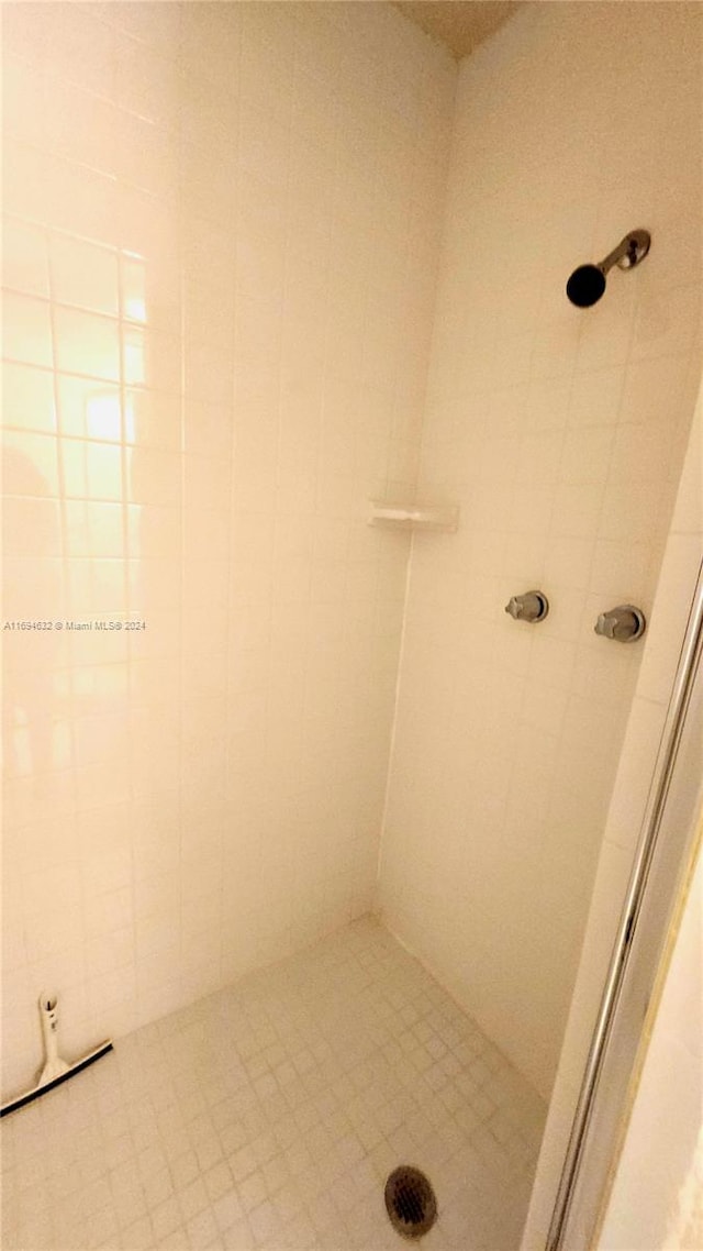 bathroom with tiled shower