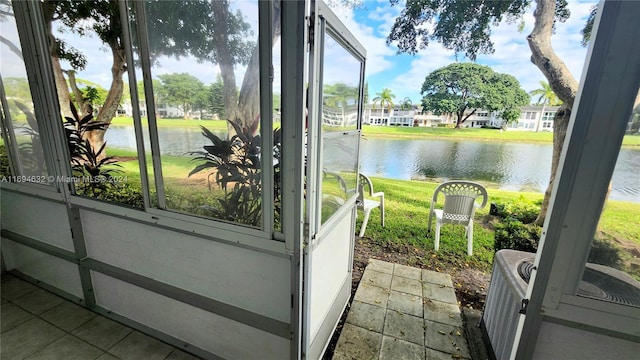 sunroom with a water view