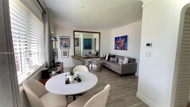 dining space with hardwood / wood-style floors