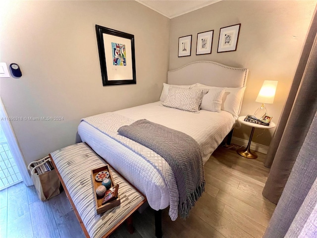 bedroom featuring wood-type flooring