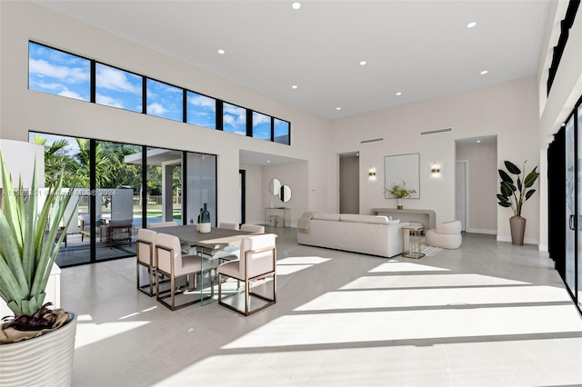 living room with a high ceiling