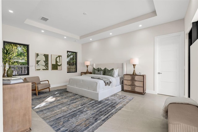 bedroom with a raised ceiling